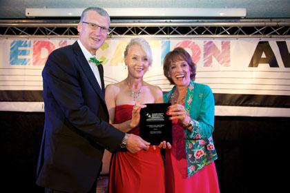 Jeanette Craig (centre) accepts The Diageo Action Against Misuse Of Alcohol Project Award on behalf of Dixons City Academy from Gordon Valentine representing The Police Community Clubs Of Great Britain and Esther Rantzen CBE | Community Education Awards with Community Initiative Associates